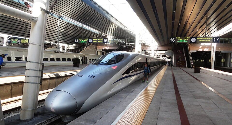 A China Railway high-speed train standing beside a platform at Nanjing South Railway Station