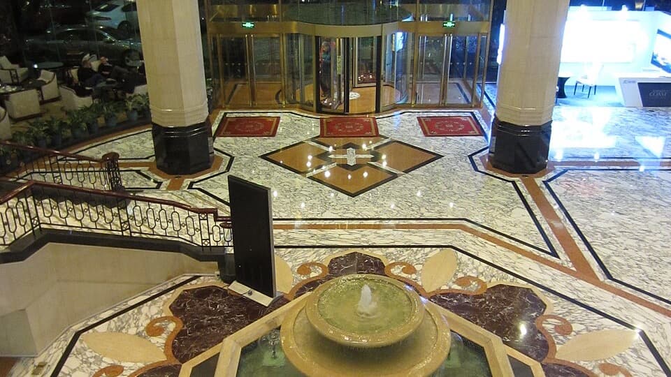 The lobby entrance, fountain and red lanterns inside Prime Hotel Beijing