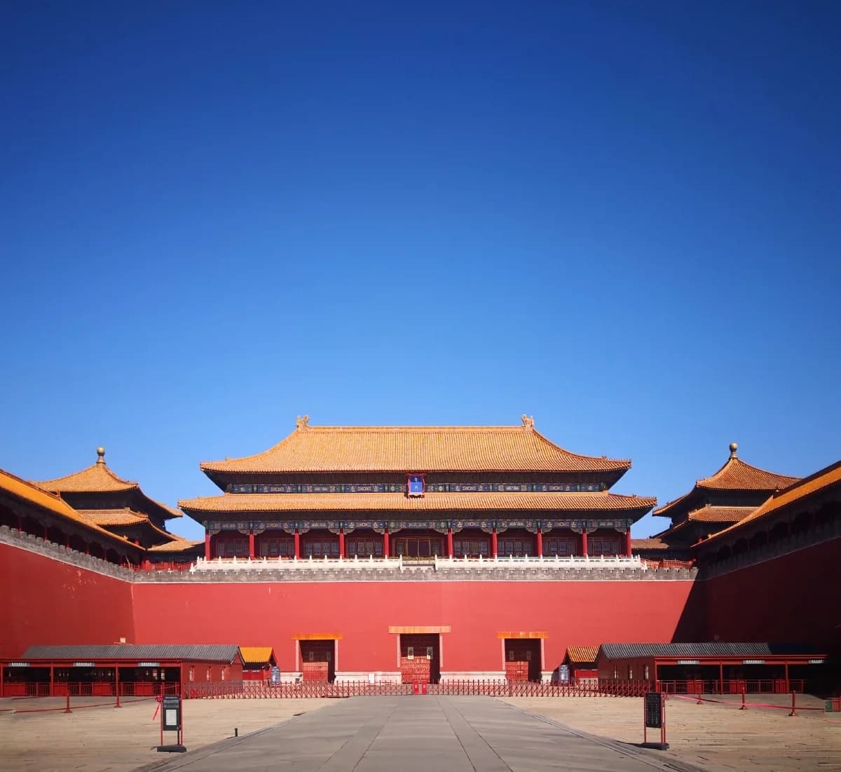 The red walls and gold roofs of the Meridian Gate at the Forbidden City