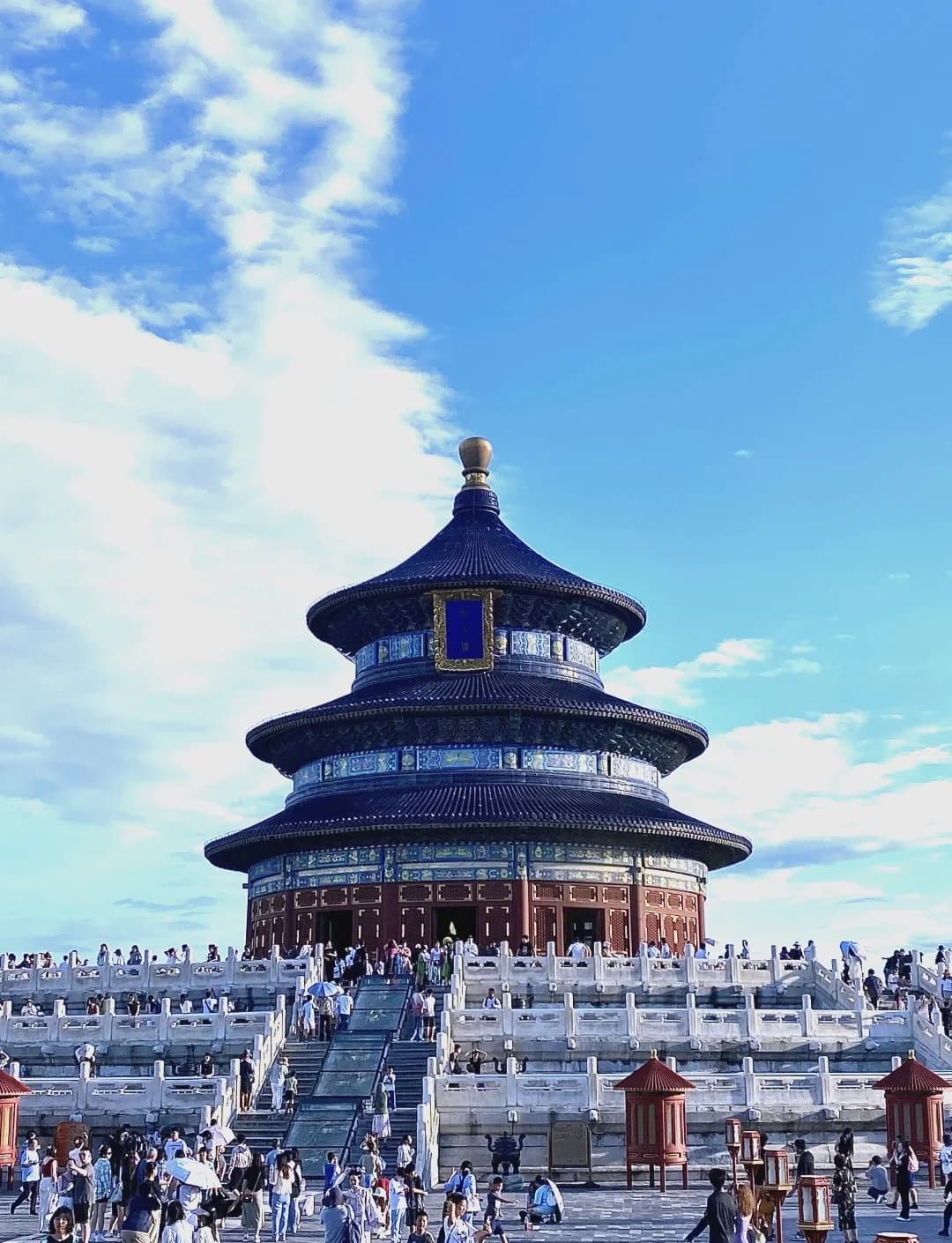 Hall of Prayer for Good Harvests with visitors on its white stone terraces