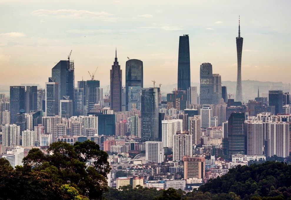 Guangzhou skyline with Canton Tower and green hills in the foreground