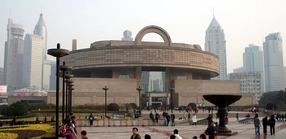 Shanghai Museum at People’s Square, with a round roof and a large arch above its entrance.