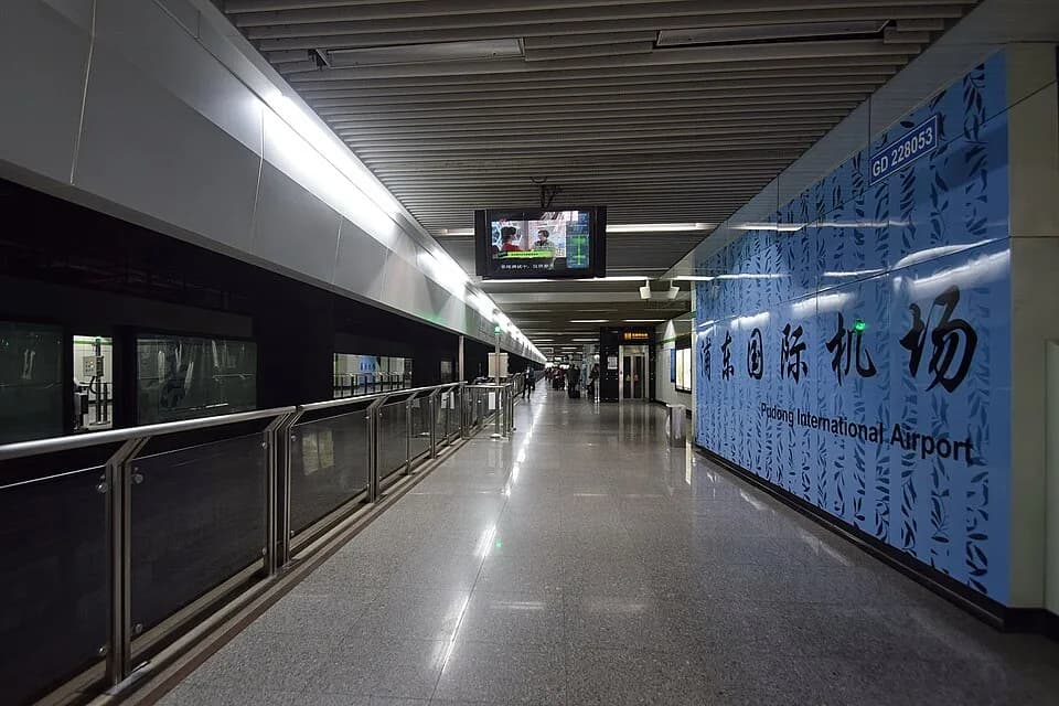 Platform at Pudong International Airport station on Metro Line 2, with bilingual station lettering.