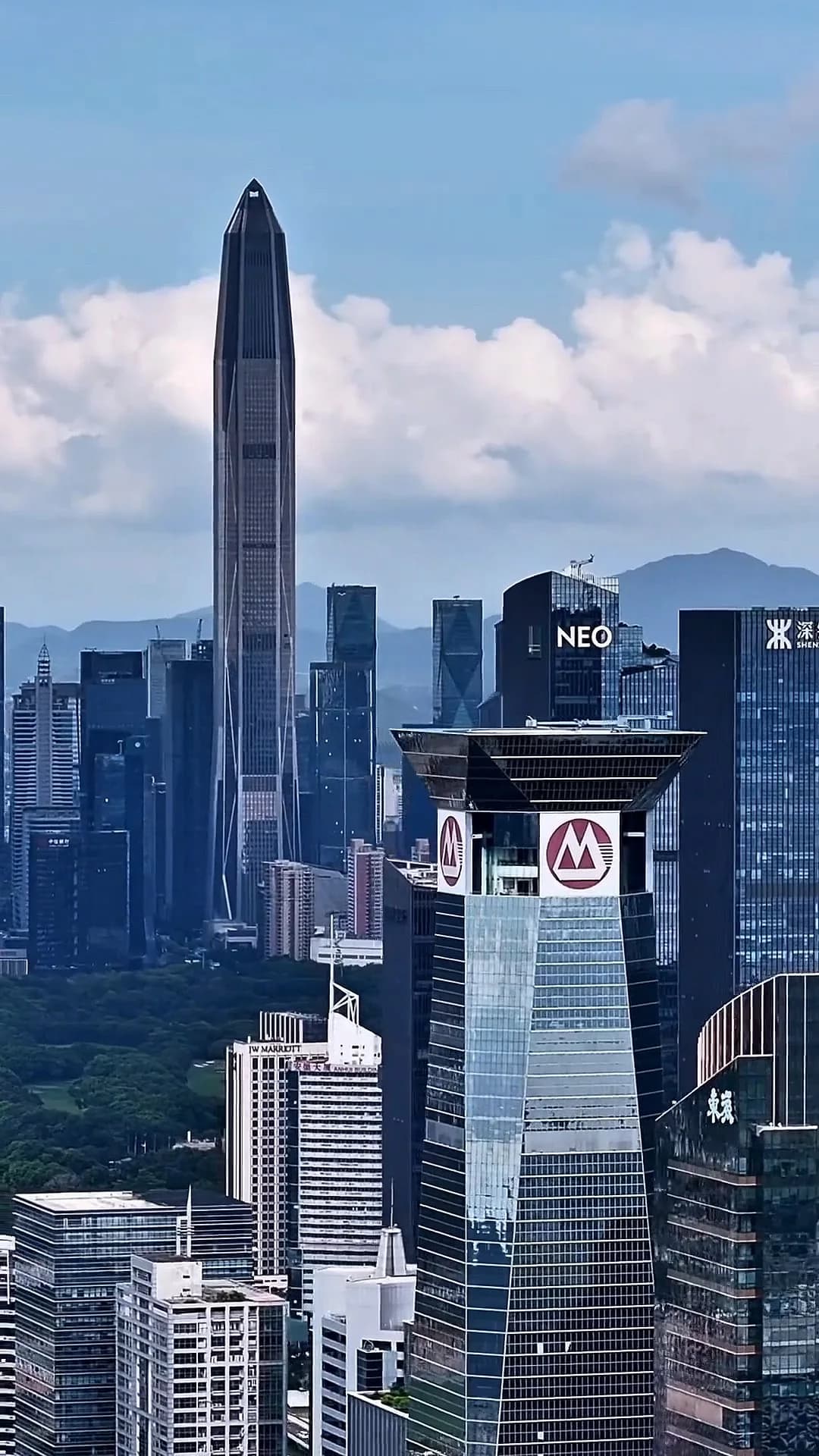 Futian high-rises with the tall pointed Ping An Finance Centre rising above the skyline.