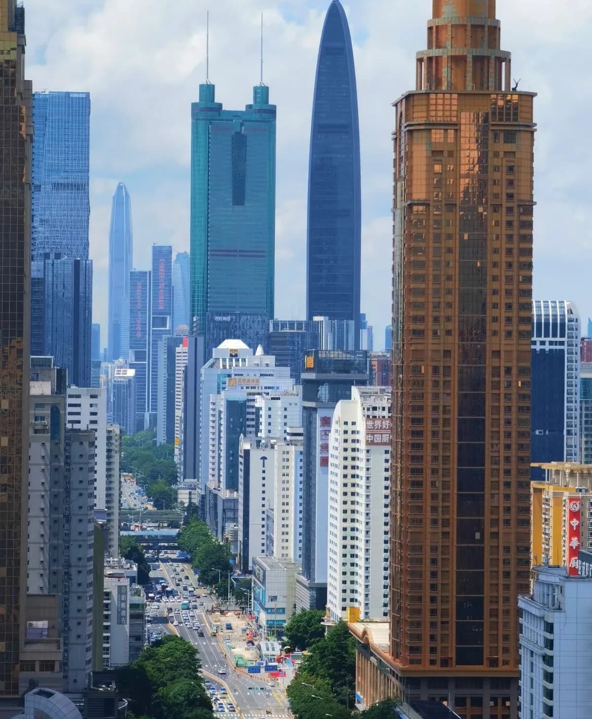 A street running between densely packed high-rise buildings in Luohu.