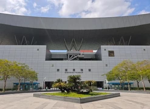 The Shenzhen Museum entrance and forecourt below a broad curved roof.